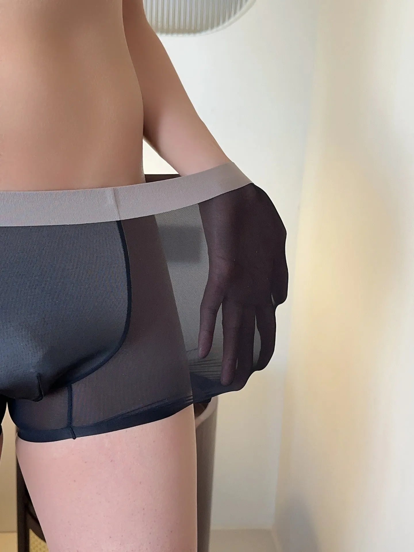 Ultra-thin seamless men's boxers in multiple colours showing honeycomb crotch design and mid-waist cut