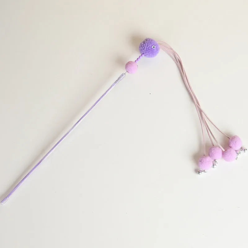 Funny cat stick toy with colourful feather tassel on elastic cord, shown in blue, pink, and purple options.