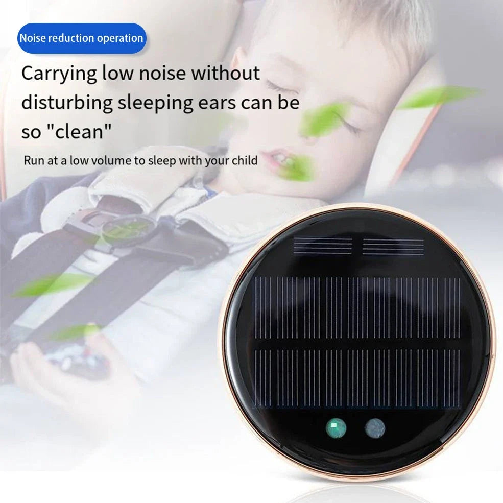 Black solar-powered car humidifier mounted on air conditioning vent with water mist visible