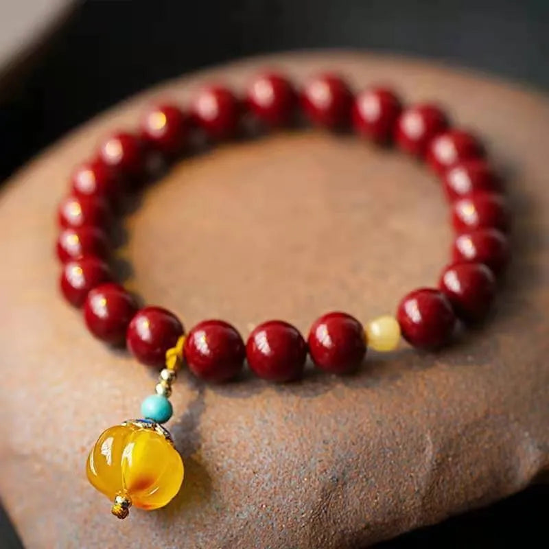 Handmade gold cinnabar wave bracelet with copper beads in national style.