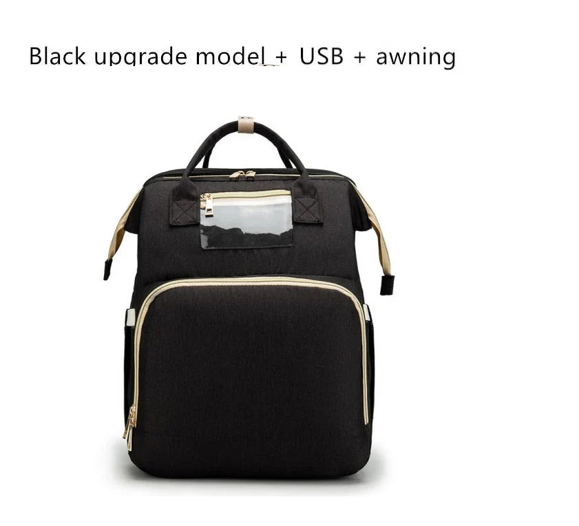 Versatile baby changing backpack with USB charging port and folding portable bed