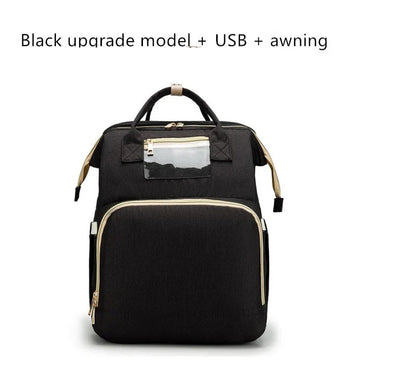 Versatile baby changing backpack with USB charging port and folding portable bed