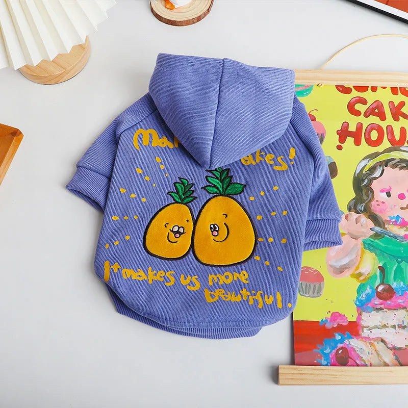 Blue and purple cartoon printed cotton hoodie for pets on a dog or cat, showing the plush design and hood.