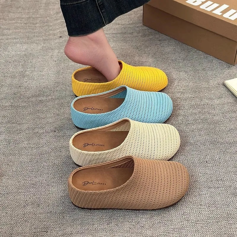 Women's non-slip cloth slippers with rubber sole in beige colour showing round toe design