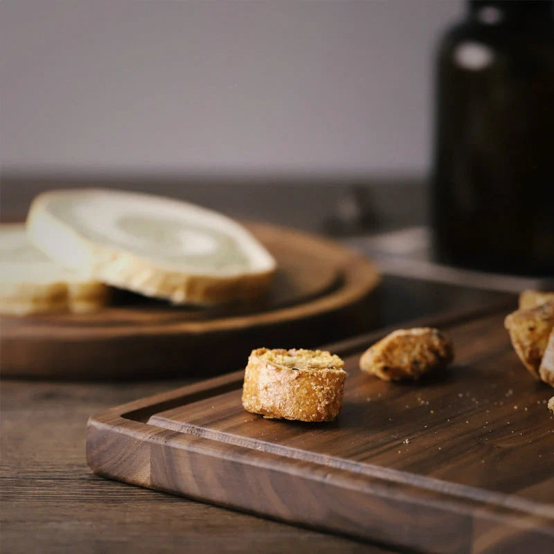 Premium black walnut wood cutting board with a versatile 2-sided design for chopping, slicing, and serving in the kitchen