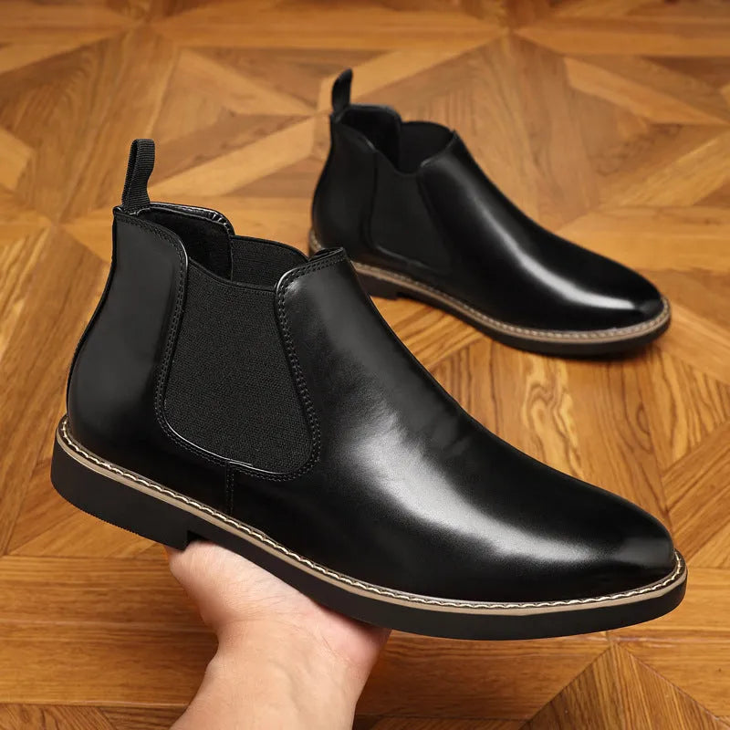 Black and brown formal pointed-toe leather boots with a square heel on a rubber sole.