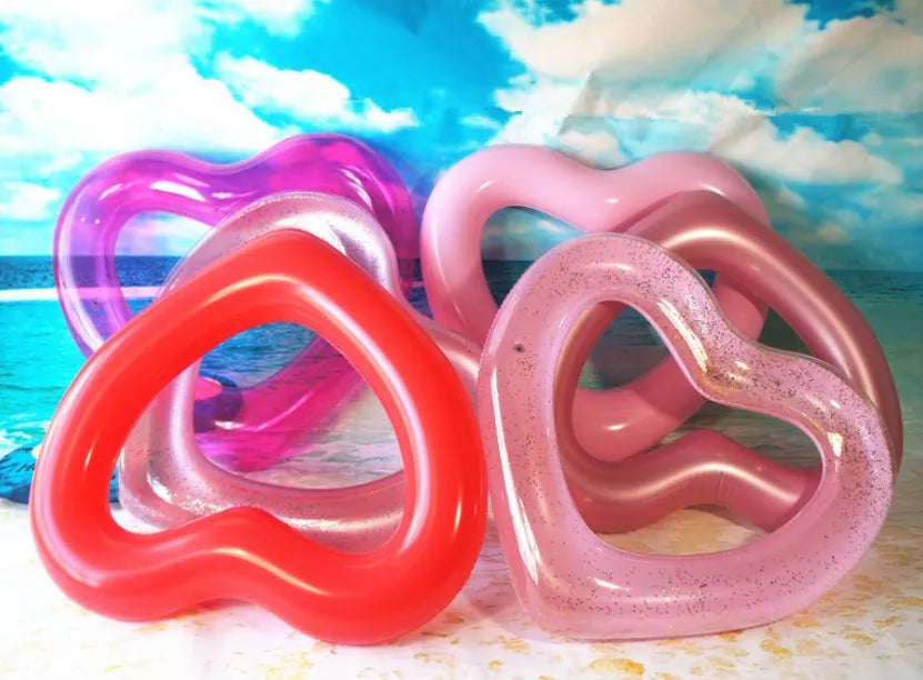 Oversized 120cm heart-shaped swim ring for adults in vibrant colors