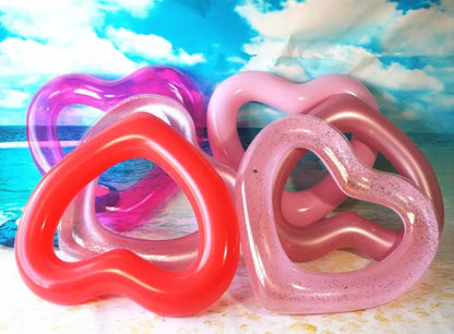 Oversized 120cm heart-shaped swim ring for adults in vibrant colors