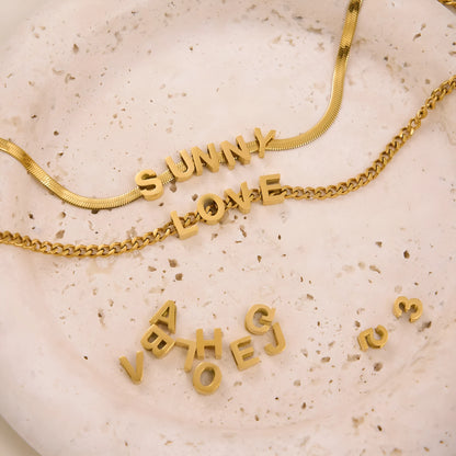 INS Commuter's necklace with 40.5cm titanium steel chain and electroplated gold or silver charms for personalisation