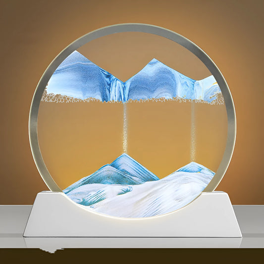 A rotary abstract night lamp with coloured sand falling inside clear glass, showing blue variant.