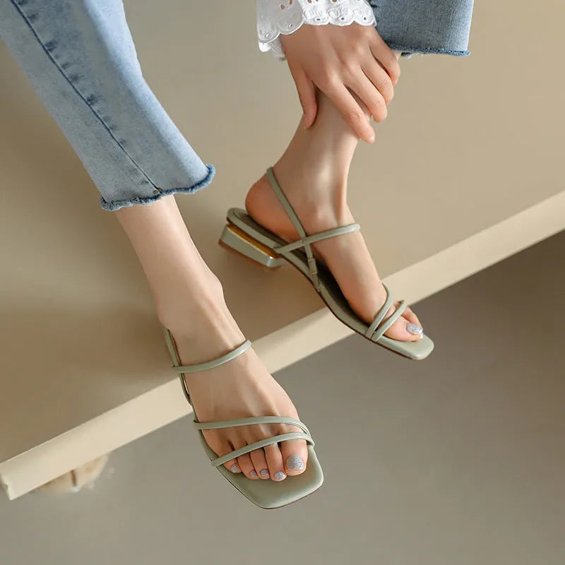 Women's flat strap Roman sandals with square toe in microfiber, showing adjustable ankle strap and multiple colour options