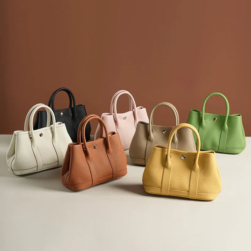 Genuine leather crossbody bag for women in first layer cowhide, horizontal square shape, single shoulder strap, shown in chicken yellow