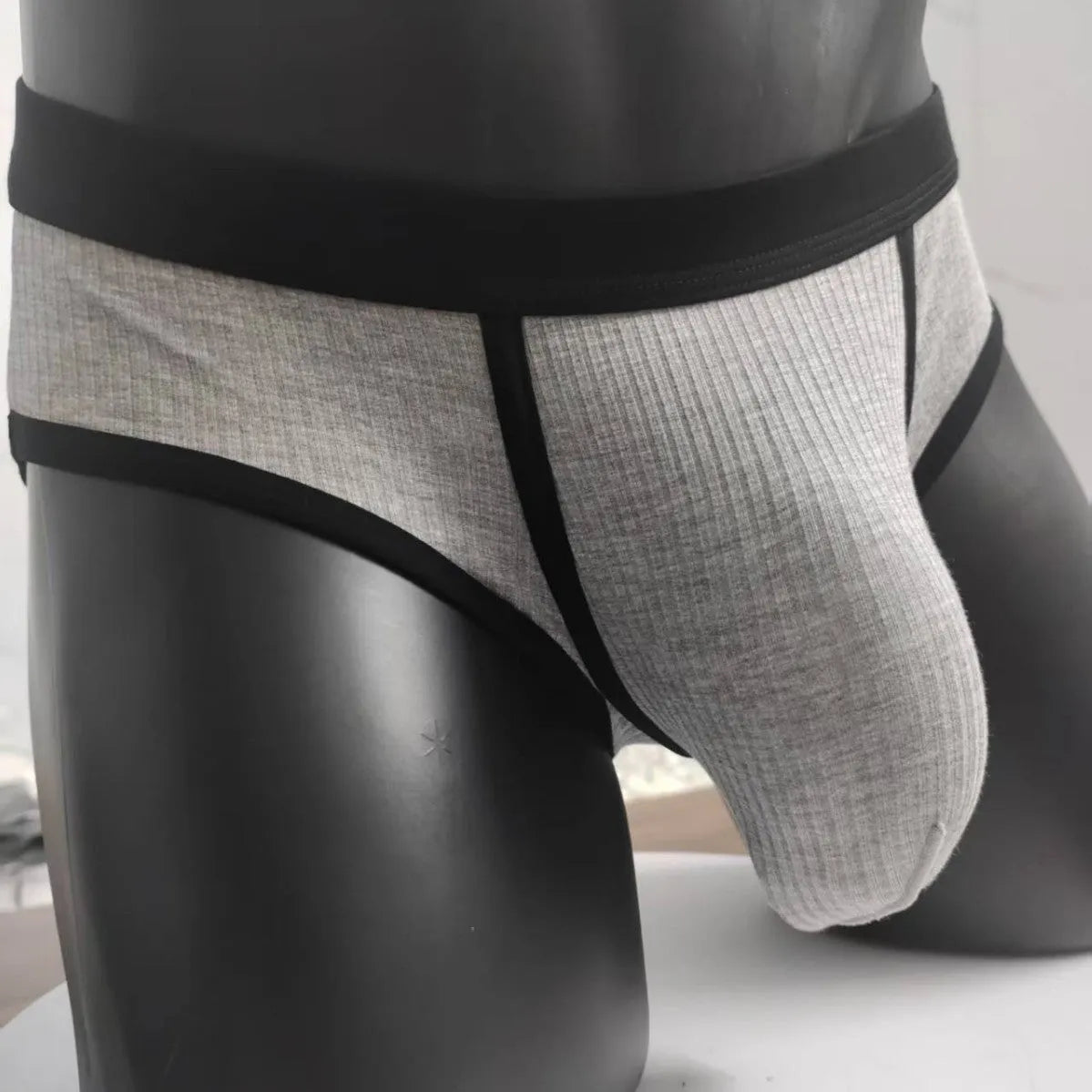 Men's solid colour viscose U-shaped pouch underwear shown in multiple sizes and colours.