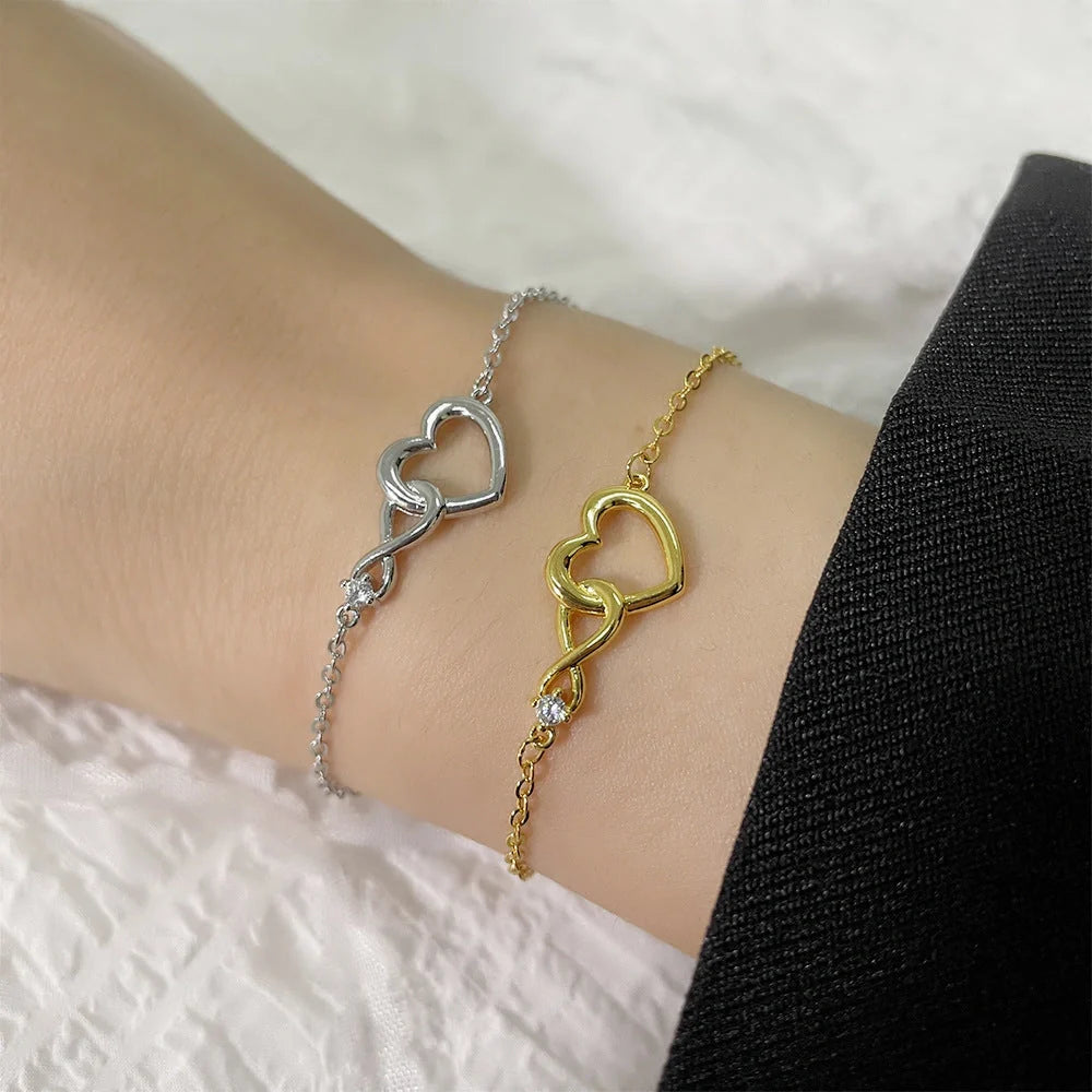 Heart-shaped bracelet with 3A zirconia in platinum and golden colors