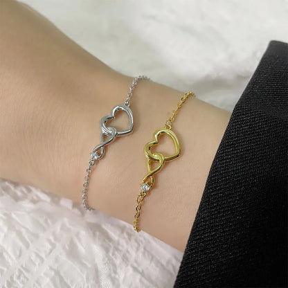 Heart-shaped bracelet with 3A zirconia in platinum and golden colors