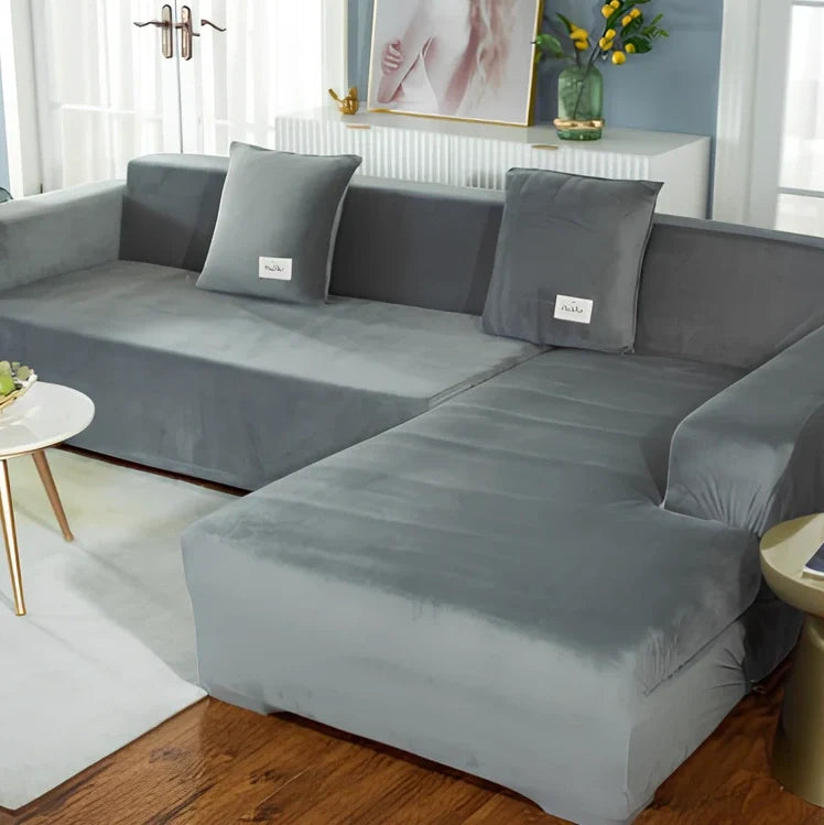 Silver Fox Velvet elastic sofa cover stretched over grey sofa showing fitted appearance