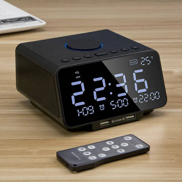Black wireless alarm clock speaker with dual speakers, display, and control buttons