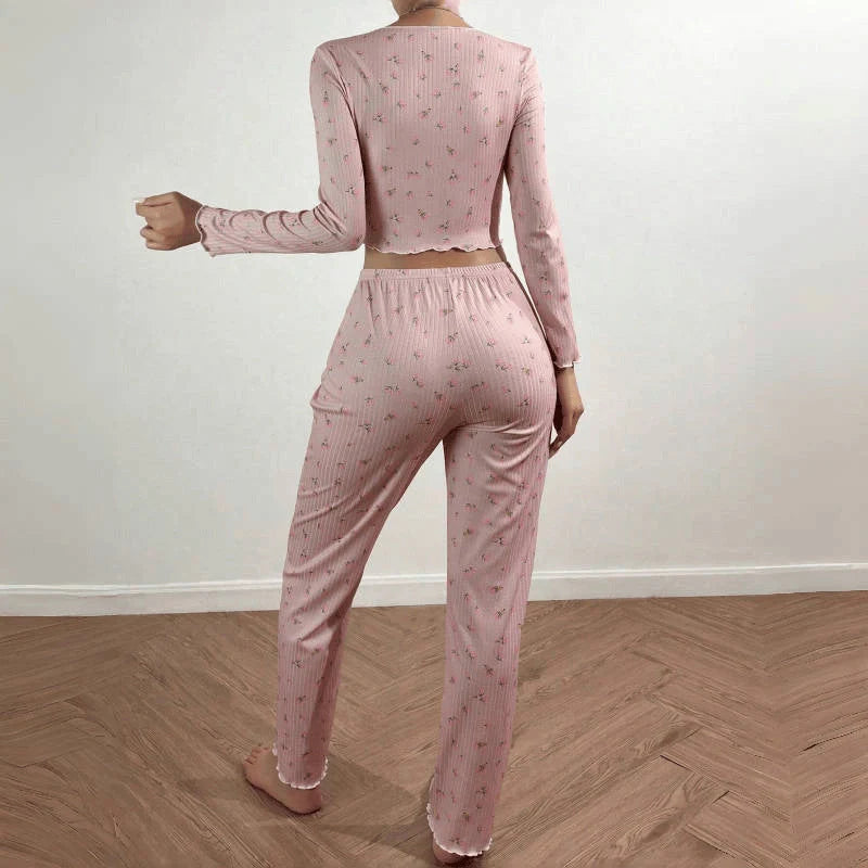 Stylish two-piece loungewear set in vibrant floral prints, featuring a long sleeve top and coordinating pants for all-season comfort and versatility.