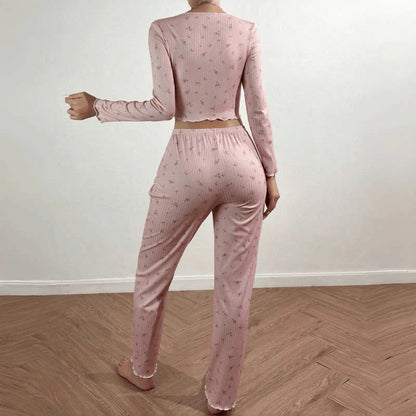 Stylish two-piece loungewear set in vibrant floral prints, featuring a long sleeve top and coordinating pants for all-season comfort and versatility.