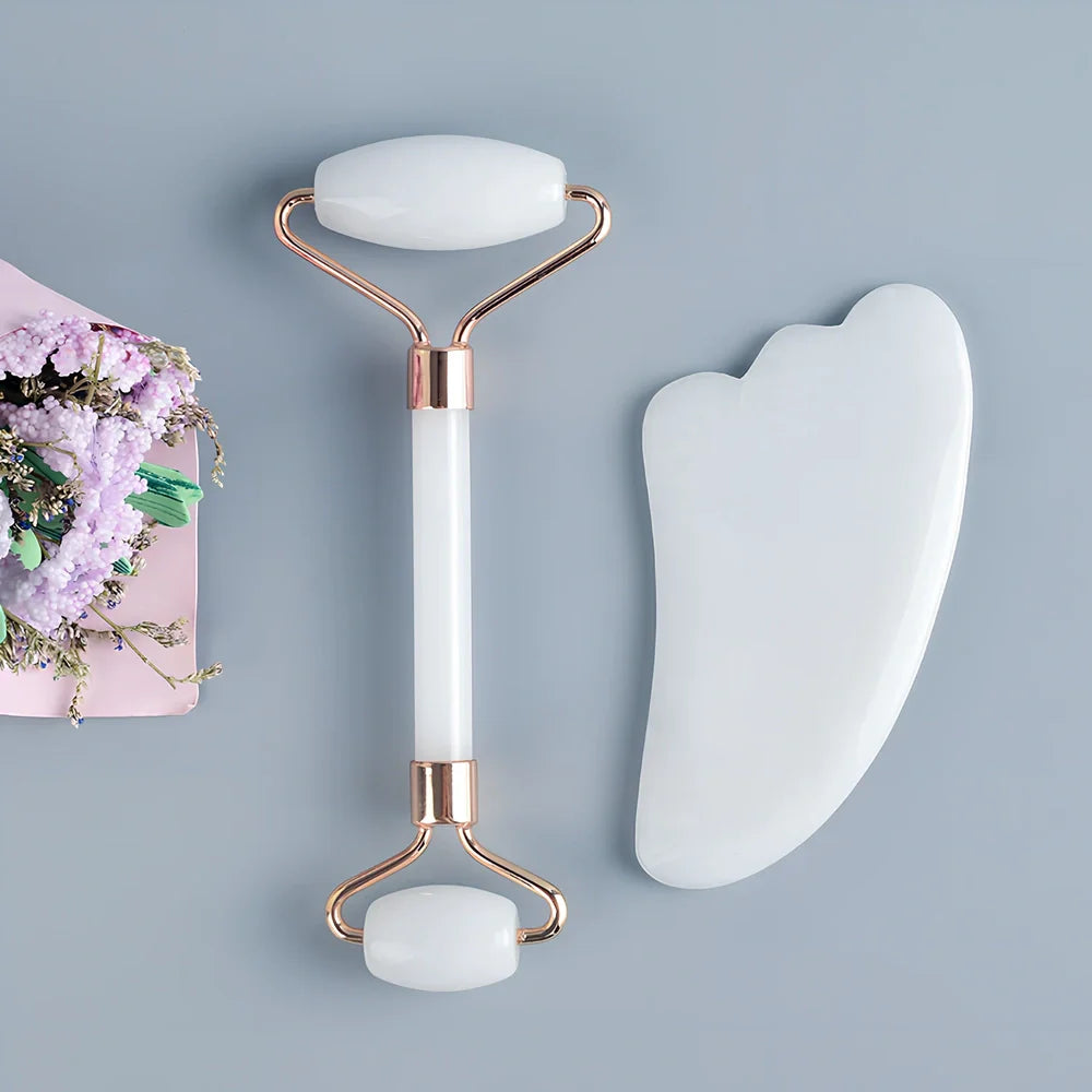 White jade facial roller with dual heads and matching scraping board for traditional Chinese massage therapy