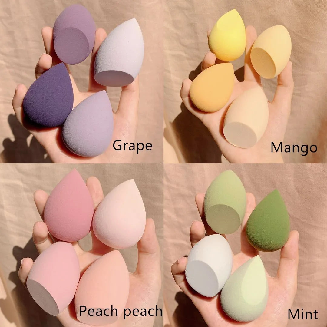 Four synthetic sponge makeup eggs in grape, mango, mint, and peach peach colours