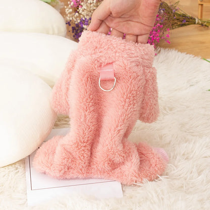Blue double-sided plush four-legged dog clothing with high collar and towing ring laid flat.