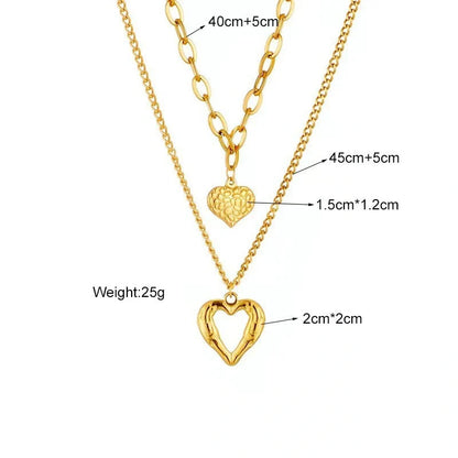 Stylish Titanium Steel Angel Wings Heart Necklace for Women in silver and golden finishes.