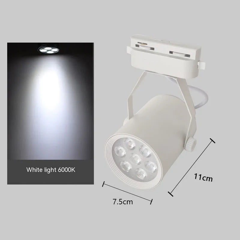 LED track spotlight with aluminium shell in black or white finish, mounted on a lighting track.