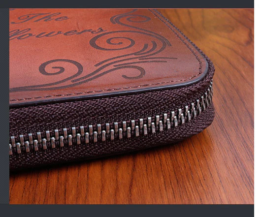 Premium leather clutch bag with hand-brushed finish, featuring multiple interior compartments for convenient organization