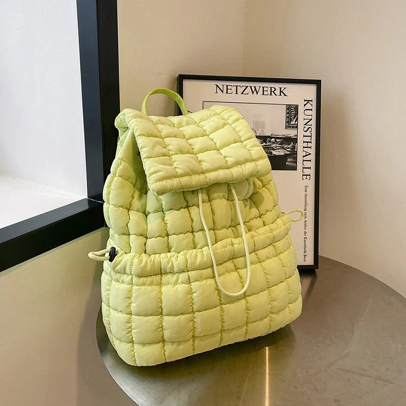 Soft, quilted puffer backpack in a variety of colors, perfect for autumn and winter wear