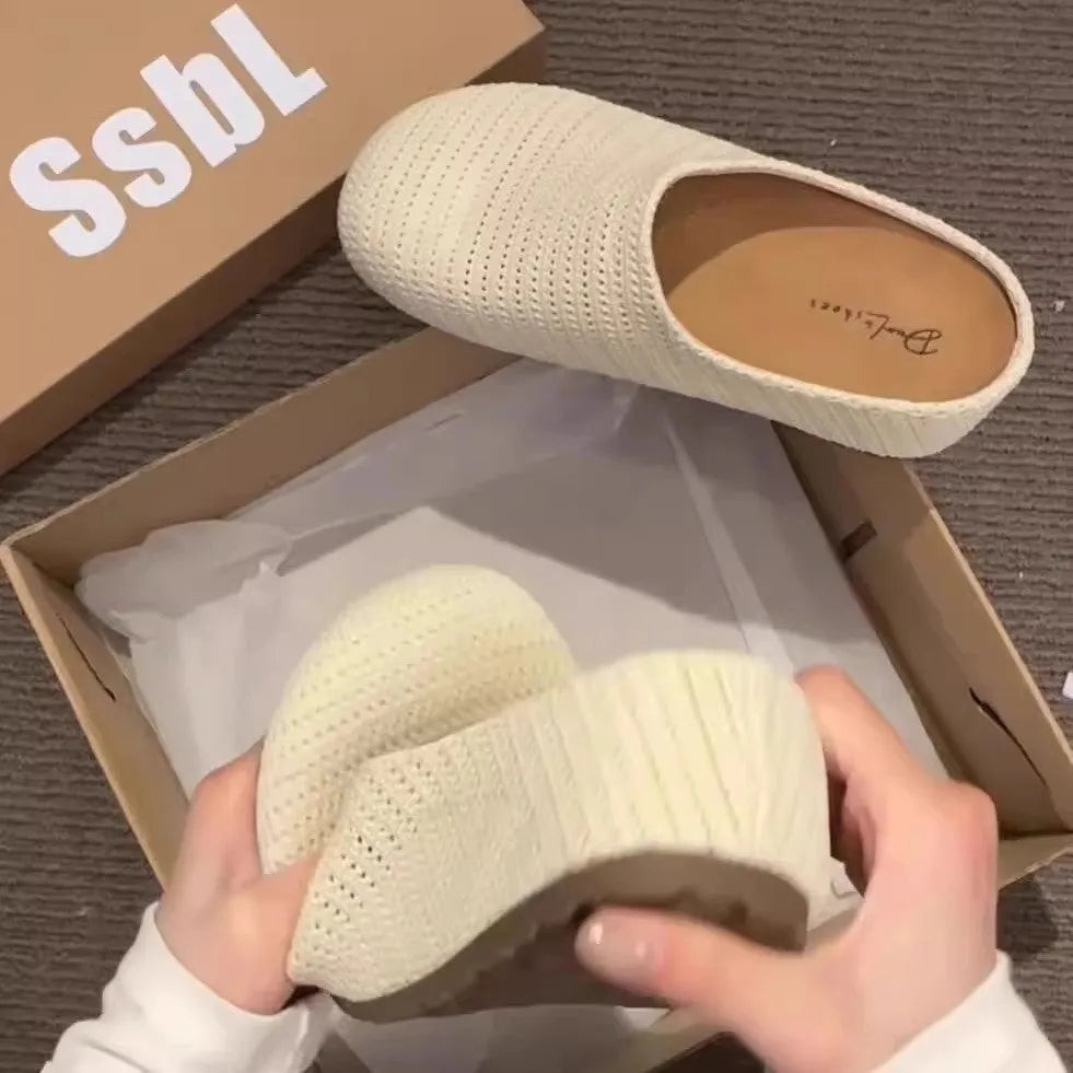 Women's non-slip cloth slippers with rubber sole in beige colour showing round toe design