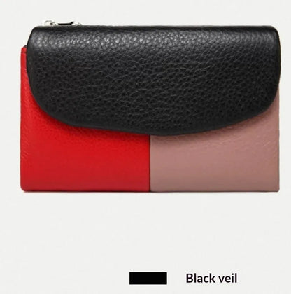 Women's short wallet in soft leather texture with solid colour and stitching detail, urban minimalist style
