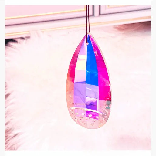 Electroplated crystal pendant ornament catching light, available in Chafer, Christmas Tree, earrings, and Longans styles.