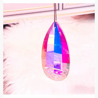 Electroplated crystal pendant ornament catching light, available in Chafer, Christmas Tree, earrings, and Longans styles.