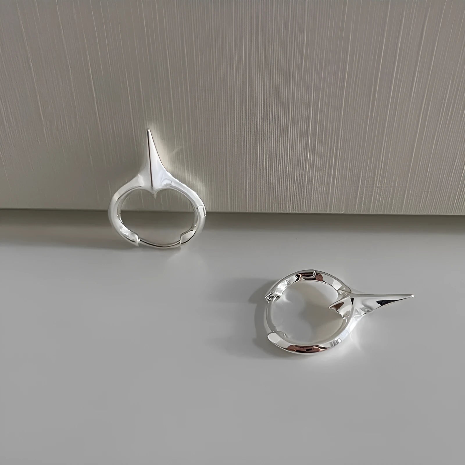 Geometric star-shaped ear clip for women in a platinum electroplated finish.