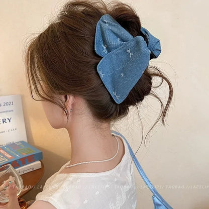Handmade fabric bow hair grip with triangle grip design and plastic hairpin