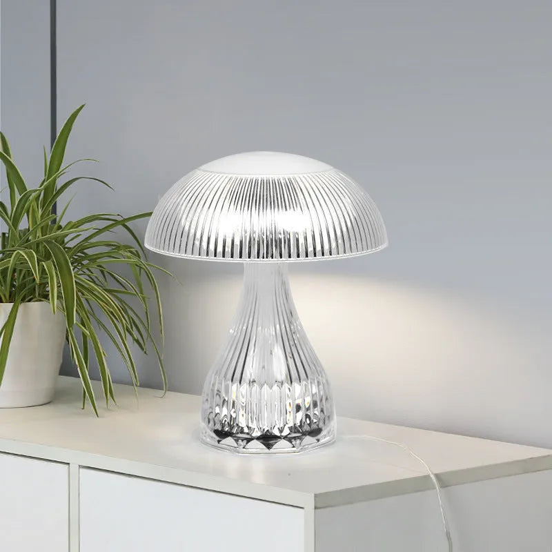 USB rechargeable acrylic table lamp with three colour changing modes on a surface.