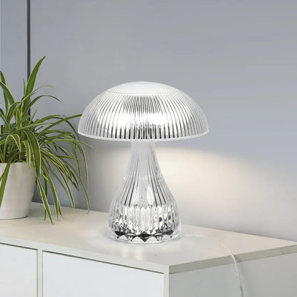 USB rechargeable acrylic table lamp with three colour changing modes on a surface.