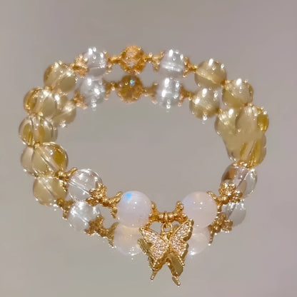 Chinese style white crystal beaded bracelet with citrine butterfly charm on adjustable string.