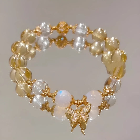 Chinese style white crystal beaded bracelet with citrine butterfly charm on adjustable string.