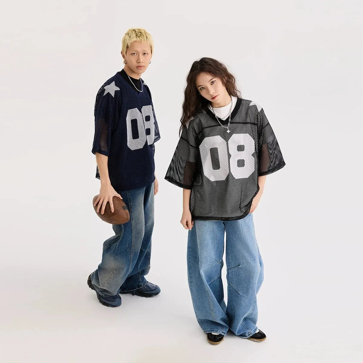 Black loose fit half sleeve shirt with a white letter print, laid flat.