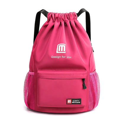 Large bucket-shaped travel backpack in blue with drawstring closure and soft black shoulder straps.