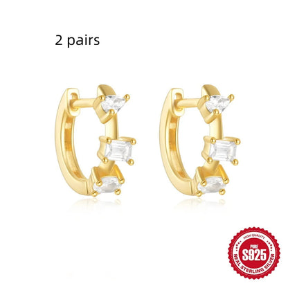 Sterling silver geometric stud earrings with small round diamond accents in gold or silver finish