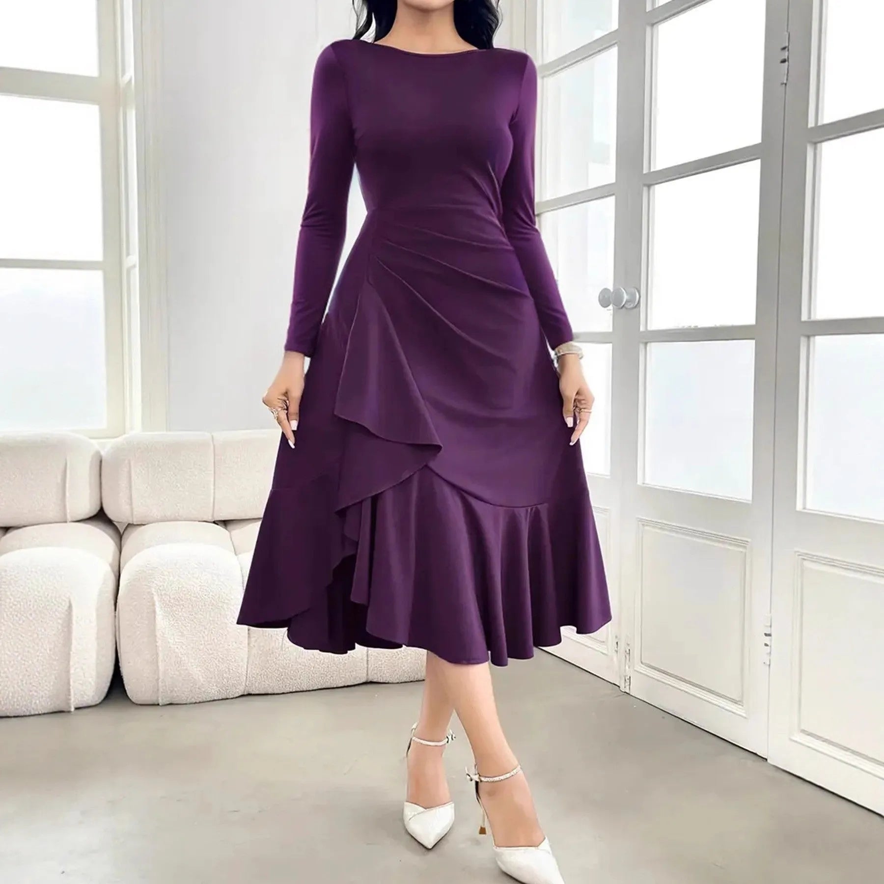 Purple women's dress with long sleeves, round neck, and ruffle detailing on a mannequin