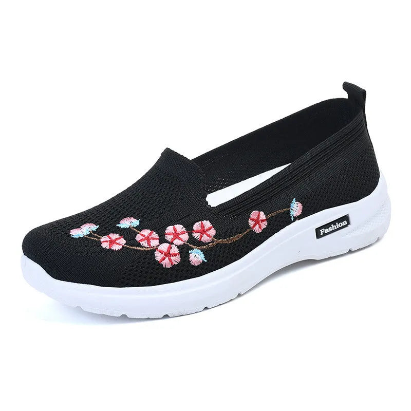 Women's low-top embroidered fly knit sports pumps in wine red with anti-slip sole.