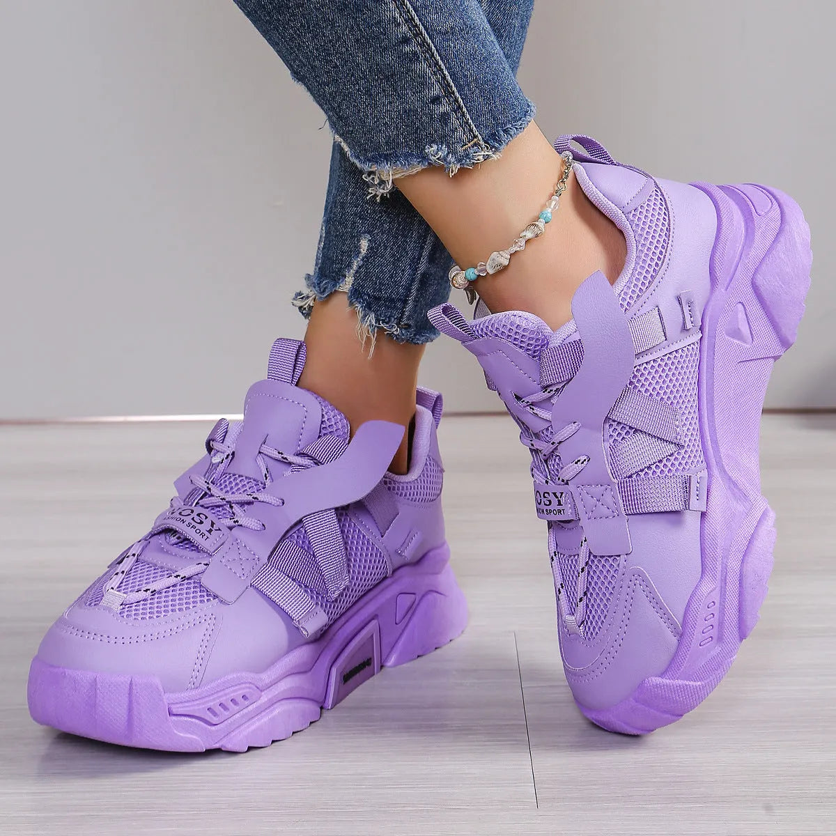 Women's platform sneakers in animal print with breathable mesh upper and front lace-up design.