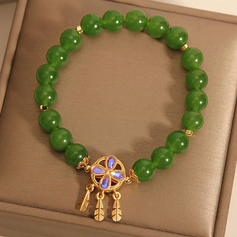 Green Jasper crystal bracelet for women with a four-leaf clover dream catcher pendant.