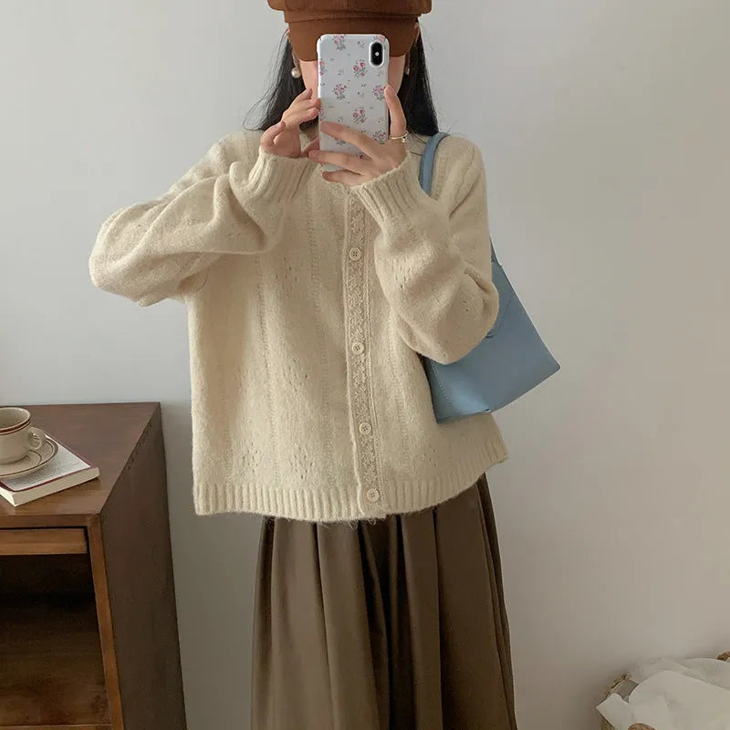 Loose-fitting artistic retro sweater coat in viscose fibre, shown in apricot colour.