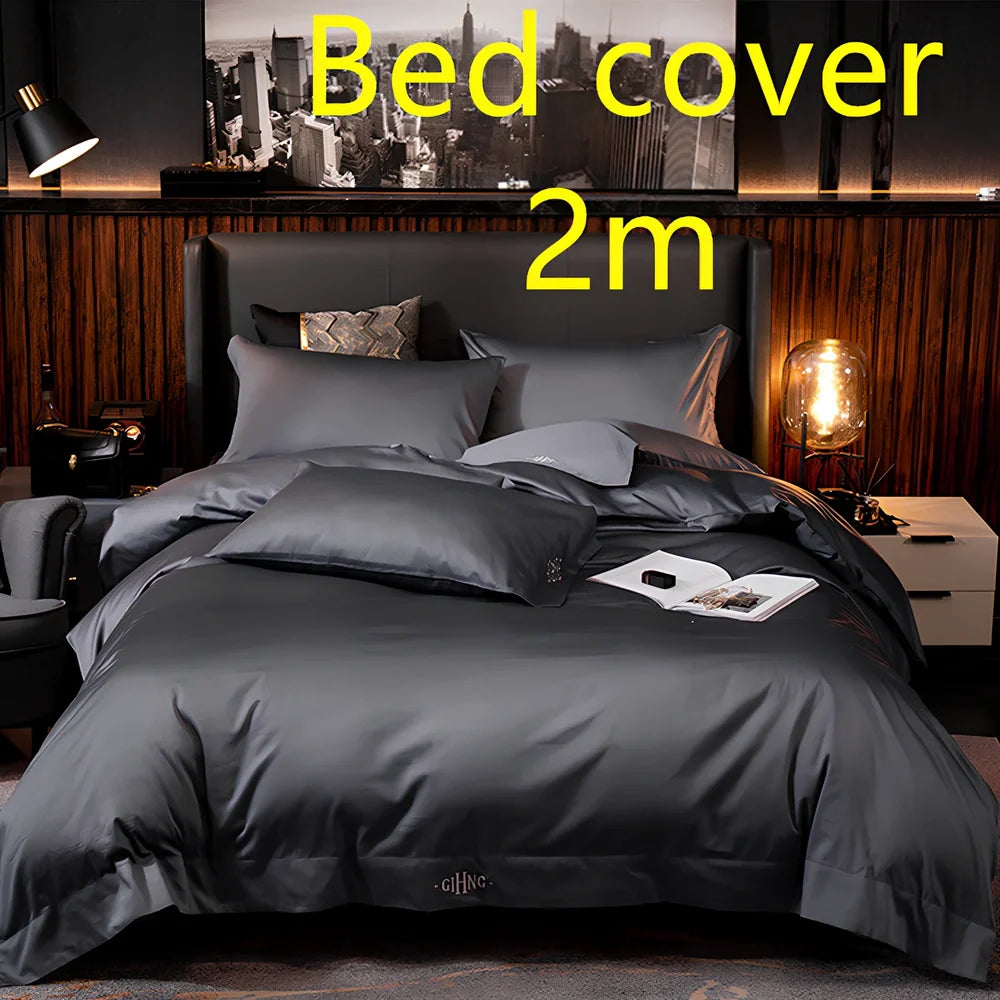 Four-piece quilted cotton bed set in royal blue, showing 200x230 cm cover and 48x74 cm pillowcases for 1.5m bed