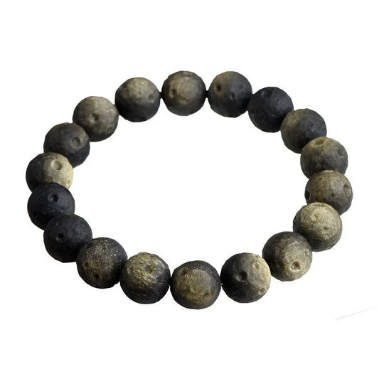 Natural obsidian crater ball bracelet with grinding treatment showing smooth bead texture in silver or golden meteorite colours